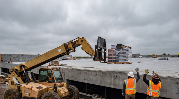 Telehandler or Crane? How Commercial Roofing Crews Are Rethinking Rooftop Material Logistics