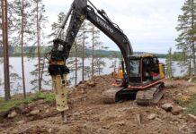 The Volvo excavator and Normet Xrock breaker at work on the rocky island near Tahko, Finland, where Tommi Makinen is building a smoke sauna.