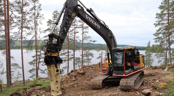 The Volvo excavator and Normet Xrock breaker at work on the rocky island near Tahko, Finland, where Tommi Makinen is building a smoke sauna.