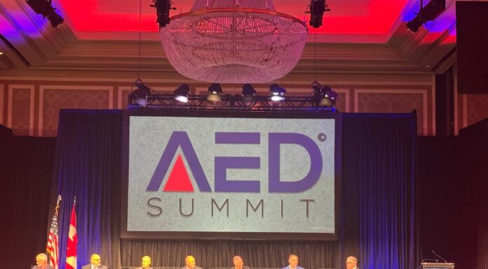 The Dealers Get One Voice: NAEDA and AED Agree to Merge Into Associated Equipment Dealers Dealers and manufacturers on stage at the AED Summit (Image: AED)