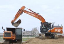 Medium hydraulic excavator performing excavation work
