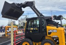 JCB Brings Its One-Armed Loader to the Class Everyone Else Owns The new JCB 290 skid steer loader, showing the single-arm boom and side-door entry that distinguish it in the mid-size class.