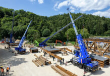 Four THW Liebherr LTC 1050-3.1 compact cranes on the pre-assembly site for the temporary Danube bridge in Tuttlingen